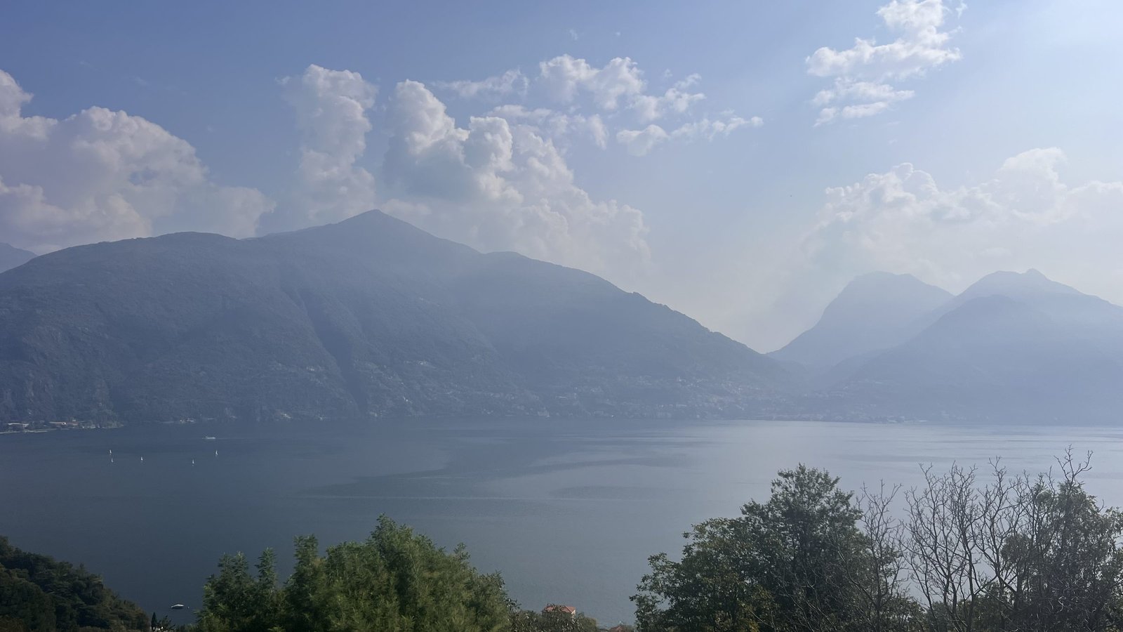 Lake Como seen from the hills above San Siro, mountains in a soft haze